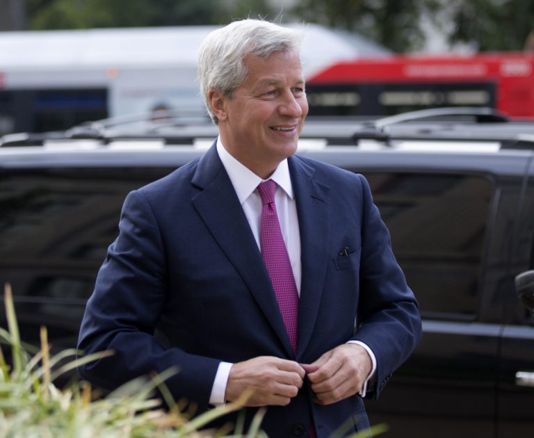   JPMorgan Chase Chairman, President and CEO Jamie Dimon, arrives at the Justice Department in Washington, Thursday, Sept. 26, 2013. An $11 billion national settlement is under discussion to resolve claims over JPMorgan's handling of mortgage-backed securities in the run-up to the recession, said a government official familiar with ongoing negotiations among bank, federal and New York state officials. (AP Photo/Manuel Balce Ceneta)  