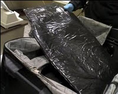 The heroin was found in the lining of a suitcase belonging to a 61-year-old passenger from Ghana, according to charging documents. The heroin was worth about $375,000 and destined for New York, authorities said.
