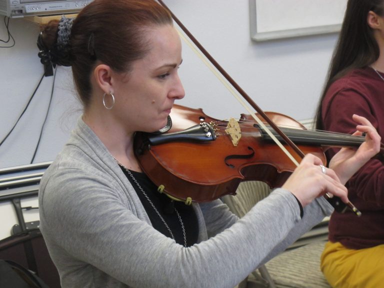   In this Nov. 17, 2012, photo, Sarah Jane Coffman practices the viola with the Hiland Mountain Correctional Facility Orchestra in Eagle River, Alaska. After serving a 14-year sentence for murder, Sarah Jane Coffman, a founding member of the women's string orchestra at the prison in 2003, will debut as a citizen member when the two annual holiday concerts are held Dec. 8, 2012. (AP Photo/Mark Thiessen)  
