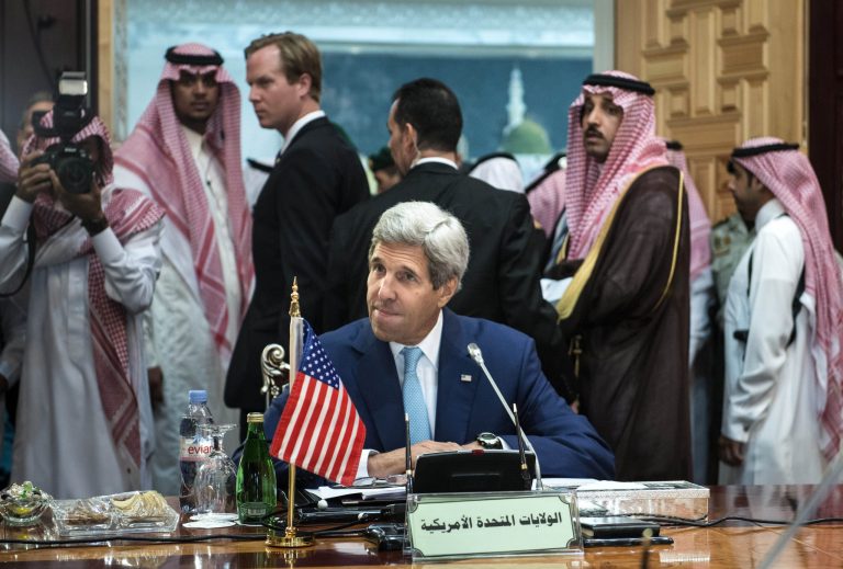 FILE - In this file photo taken Thursday, Sept. 11, 2014, U.S. Secretary of State John Kerry waits for the start of a meeting of the Gulf Arab region at King Abdulaziz International Airport in Jiddah, Saudi Arabia. (AP Photo/Brendan Smialowski, Pool, File)