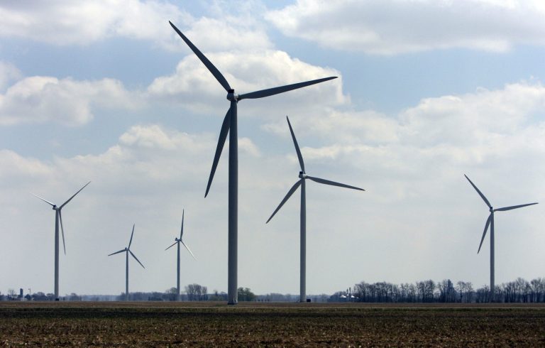 FILE-- This April 21, 2008, file photo shows wind turbines at the Harvest Wind Farm in Oliver Township, Mich. State officials say Michigan is positioned to require more of its electricity to come from wind and other renewable sources. Existing law sets a 10 percent target that must be met in 2015. Michigan officials will assess the impact on the state when President Barack Obama on Monday, June 2, 2014, announces tougher new air quality standards affecting coal-fired power plants. Coal produces about 55 percent of the electricity in the state while natural gas produces 11 percent. (AP Photo/Al Goldis, File)