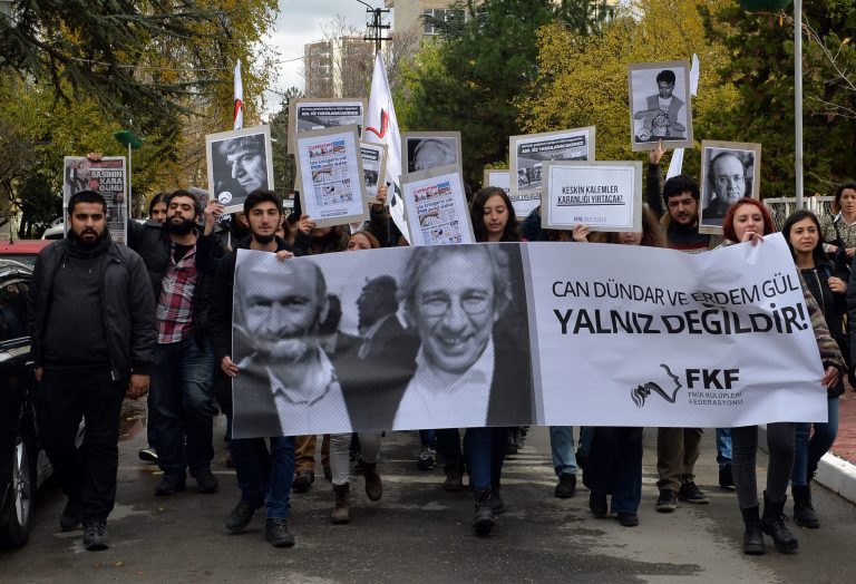 The two Turkish journalists were charged with revealing state secrets and espionage. (AP Photo)