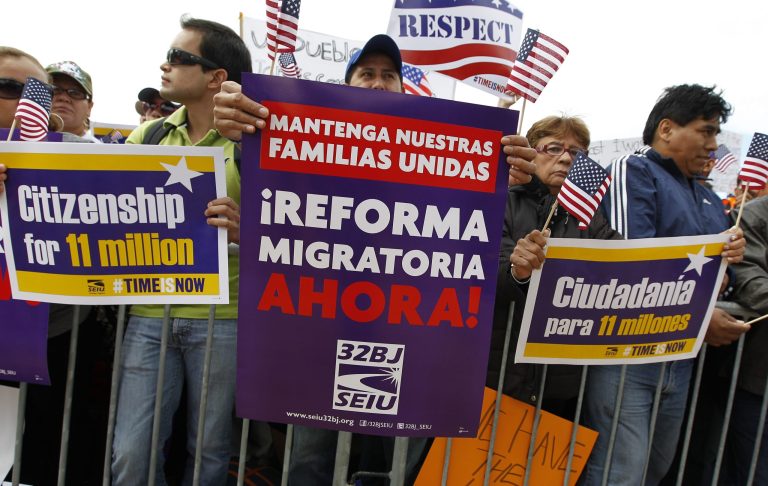Demonstrators hold up their banners during a immigration a rally on the National Mall in Washington, Tuesday, calling on the House Republican leadership to pass comprehensive immigration reform with a path to citizenship. ( AP Photo/Jose Luis Magana)