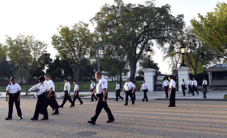 Uniformed Secret Service officers walk along Pennsylvania Avenue in front of the White House and head to Lafayette Park in Washington. The Secret Service is coming under intense scrutiny after a man who hopped the White House fence made it all the way through the front door before being apprehended. (AP Photo/Susan Walsh)