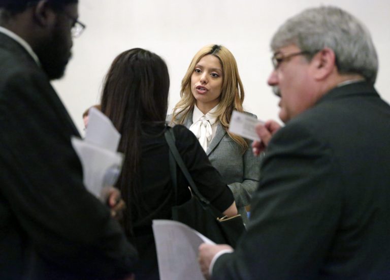 Erika Padilla, center, and Michael McKeown, right, meet with job applicants during a National Career Fairs job fair, in Chicago. The Labor Department releases weekly jobless claims on Thursday, May 7, 2015. (AP Photo/M. Spencer Green)