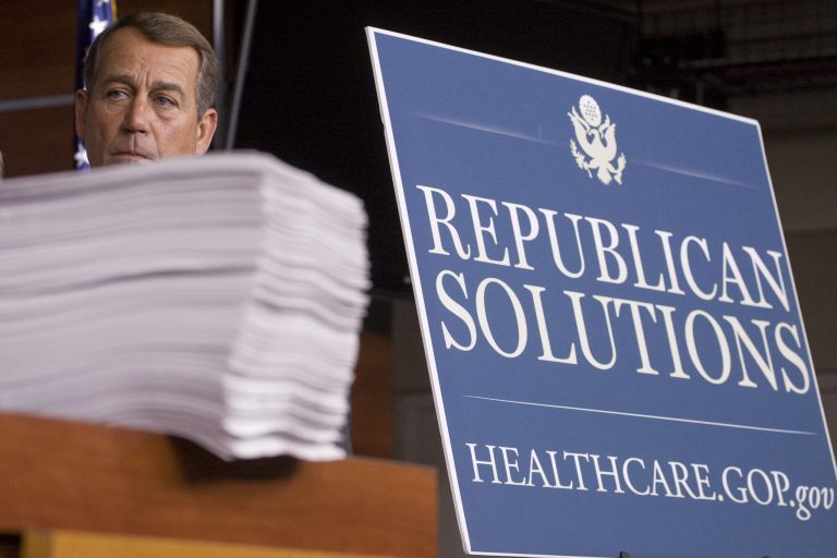 In this Oct. 29, 2009, file photo then-House Minority Leader John Boehner (R-Ohio) stands behind a copy of the Democrat's version of the health care bill during a news conference on Capitol Hill in Washington. (AP Photo/Harry Hamburg)