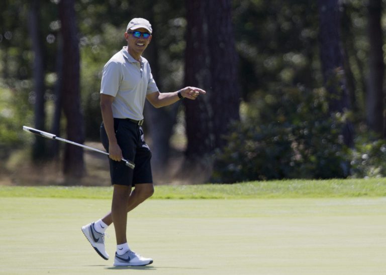 President Barack Obama reacts after putting on the first green as he plays golf at Farm Neck Golf Course in Oak Bluffs, Mass., on Martha's Vineyard, Sunday, Aug. 7, 2016. The president and his family are vacationing on the Massachusetts island of Martha's Vineyard. (AP Photo/Manuel Balce Ceneta)