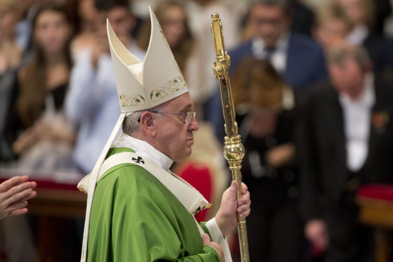Pope Francis leaves after he celebrated a Mass of Thanksgiving for the canonization of two Canadian saints, St. Francis de Laval and St. Mary of the Incarnation, in St. Peter's Basilica, at the Vatican,  Sunday, Oct. 12, 2014. (AP Photo/Andrew Medichini)