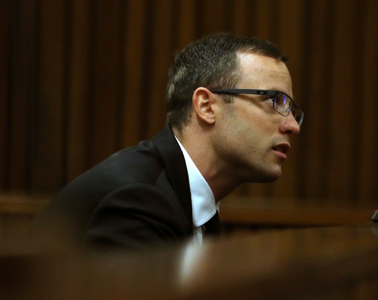 Oscar Pistorius sits in the dock at a court in Pretoria, South Africa, Monday, April 7, 2014. The defense in the Pistorius murder trial has opened its case, calling a pathologist as its first witness. Prof. Jan Botha was testifying Monday following four weeks of prosecution-led testimony and a week's adjournment after one of the judge's aides fell ill. Pistorius is charged with murder for the shooting death of his girlfriend Reeva Steenkamp, on Valentines Day 2013. (AP Photo/Themba Hadebe, Pool)