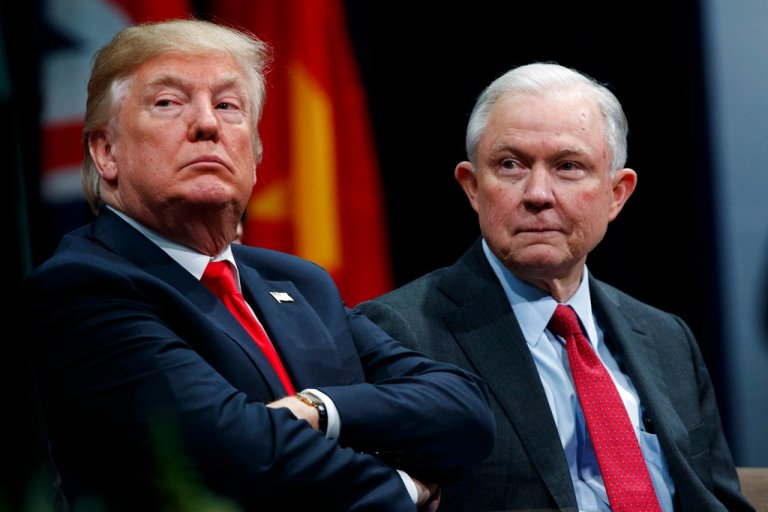 FILE - In this Dec. 15, 2017, file photo, President Donald Trump sits with Attorney General Jeff Sessions during the FBI National Academy graduation ceremony in Quantico, Va. Trump's White House counsel personally lobbied Attorney General Jeff Sessions to not recuse himself from the Justice Department's investigation into potential ties between Russia and the Trump campaign. (AP Photo/Evan Vucci, File)