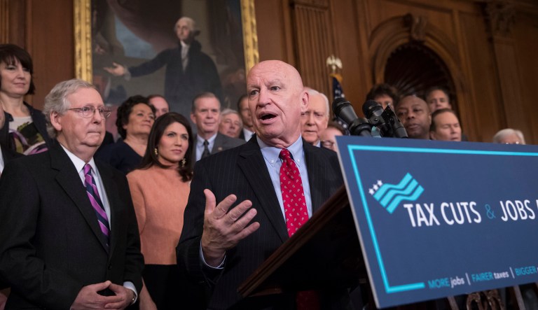 House Ways and Means Committee Chairman Kevin Brady, R-Texas, (pictured center) said he will gauge the law's success by whether it encourages companies to bring back jobs, operations, and headquarters from overseas. (AP Photo/J. Scott Applewhite)