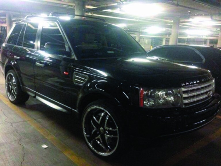 This photo provided by the Las Vegas Metropolitan Police Department shows a black Range Rover SUV in Las Vegas that was found Saturday, Feb. 23, 2013, at an apartment complex east of the Las Vegas Strip. It has been impounded as evidence in connection with a shooting that sent a Maserati into a taxi that exploded, killing three people. Police are looking for 26-year-old Ammar Harris in connection with the shooting. (AP Photo/Las Vegas Metropolitan Police Department)