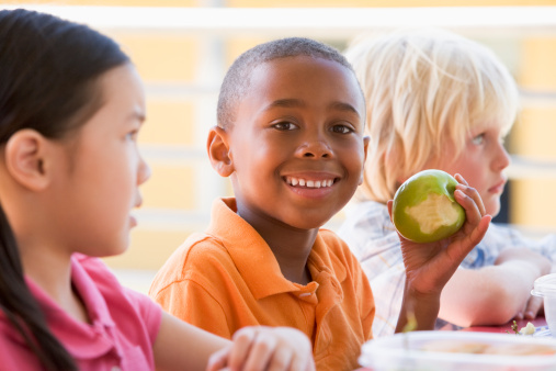 Kindergarten children eating lunch