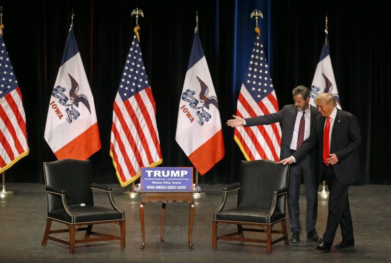 Jerry Falwell, Jr., left, president of Liberty University, guides Republican presidential candidate Donald Trump to his seat during a campaign event at the Orpheum Theatre in Sioux City, Iowa, Sunday, Jan. 31, 2016. (AP Photo/Patrick Semansky)