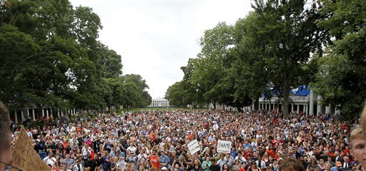 A crowd awaits remarks by University of Virginia President Teresa Sullivan after her meeting Monday with the U.Va. Board of Visitors. The university's new interim president called her firing a mistake. (AP Photo)