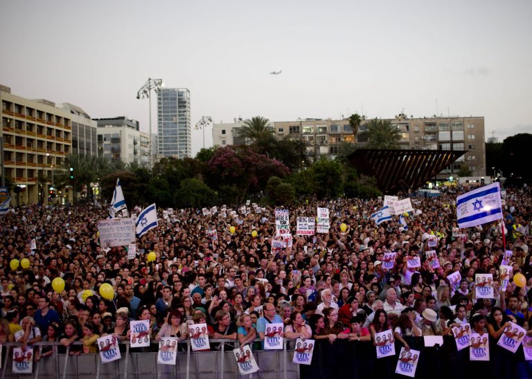 Thousands of Israelis gather for a rally calling for the release of the three missing Israeli teens, feared abducted in the West Bank on June 12, in Tel Aviv, Israel, Sunday, June 29, 2014. There has been an increase in rockets launched from the Hamas-ruled territory toward Israel this month, as the army has carried out a wide-ranging operation against Hamas in the West Bank while searching for three Israeli teens who Israel says were abducted by the Palestinian militant group. (AP Photo/Oded Balilty)