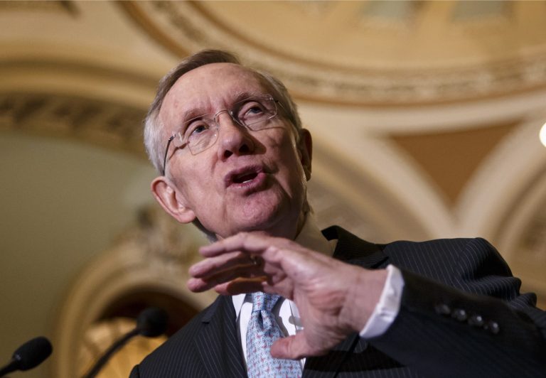 Senate Majority Leader Harry Reid, D-Nev., talks to reporters just off the Senate floor on Capitol on Tuesday. (AP Photo/J. Scott Applewhite)