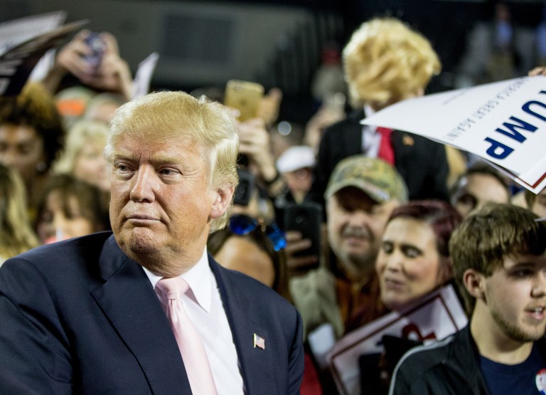 A 15-year-old boy in Georgia was arrested Friday for threatening online to kill Republican presidential candidate Donald Trump. (AP Photo/Andrew Harnik)