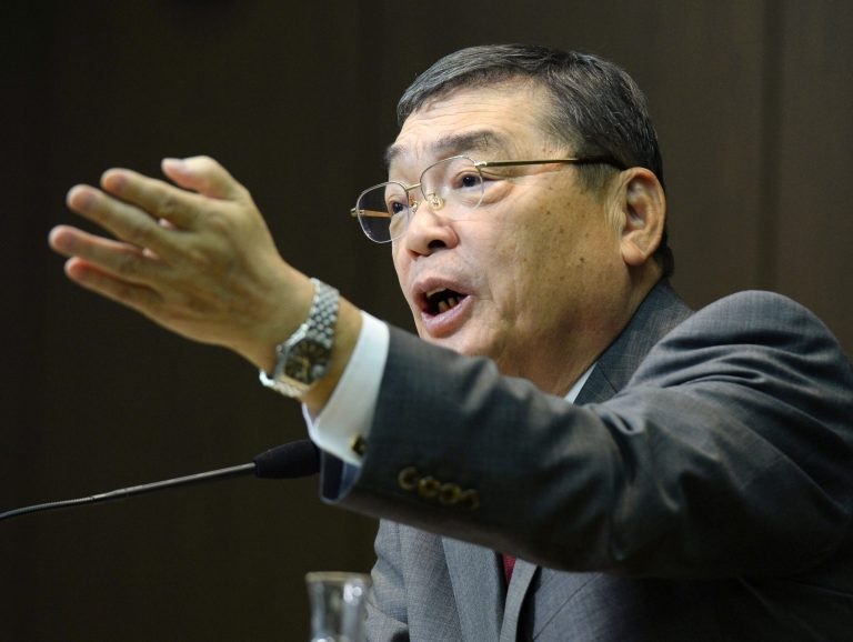In this photo taken on Saturday, Jan. 25, 2014, Katsuto Momii, new president of public broadcaster NHK, holds a news conference at the start of his three-year term in Tokyo. Japan's top government spokesman Chief Cabinet Secretary Yoshihide Suga defended Momii for his remarks that the use of women as military prostitutes was common worldwide during World War II. NHK chairman Momii told a news conference Saturday to mark his appointment that 