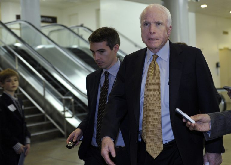 Sen. John McCain, R-Ariz. walks to a closed-door briefing on the recent agreement reached between Iran and western powers on Iran's nuclear program, Wednesday, Dec. 11, 2013, on Capitol Hill in Washington. (AP Photo/Susan Walsh)