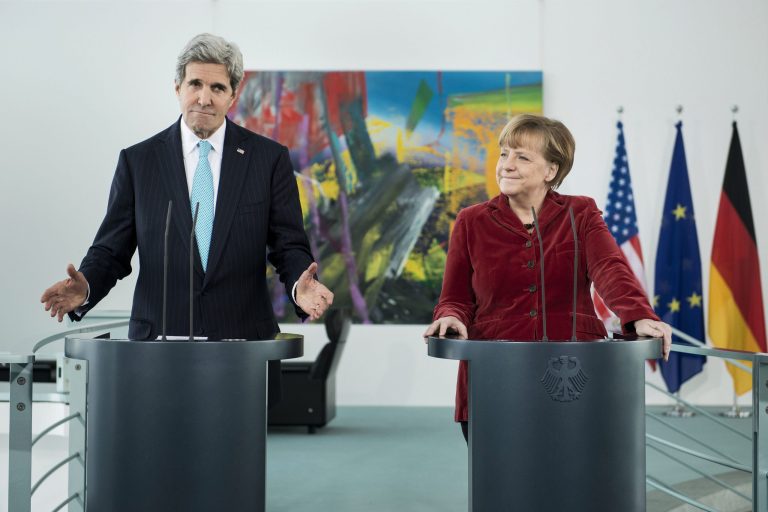 US Secretary of State John Kerry, left, and German Chancellor Angela Merkel, irght, address the media at the Chancellery in Berlin, Germany, Friday, Jan. 31, 2014. Kerry meets with members of the German government before attending the Munich Security Conference. (AP Photo/Brendan Smialowski, Pool)