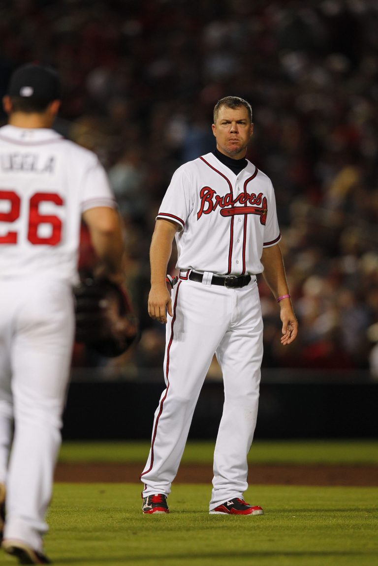 Atlanta Braves third baseman Chipper Jones (10) walks off the field after being tagged out at first base during the seventh inning  of the National League wild card playoff baseball game against the St. Louis Cardinals, Friday, Oct. 5, 2012, in Atlanta. (AP Photo/John Bazemore)