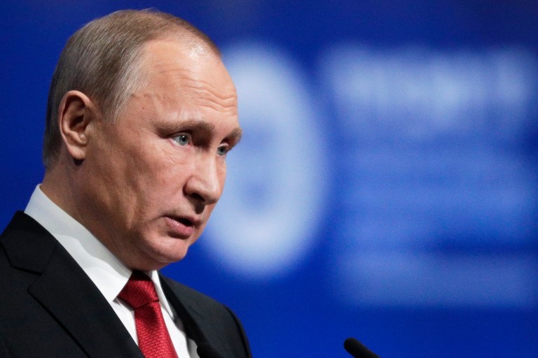 The panel was vintage Putin strategic-showmanship -- heart of the KGB stuff. (AP Photo/Dmitry Lovetsky)