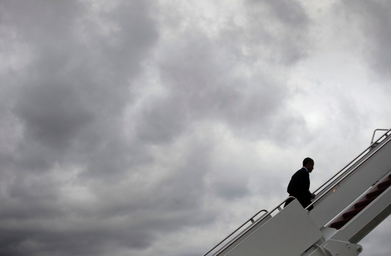 President Obama walks up the stairs as he boards Air Force One. (AP Photo/Pablo Martinez Monsivais)