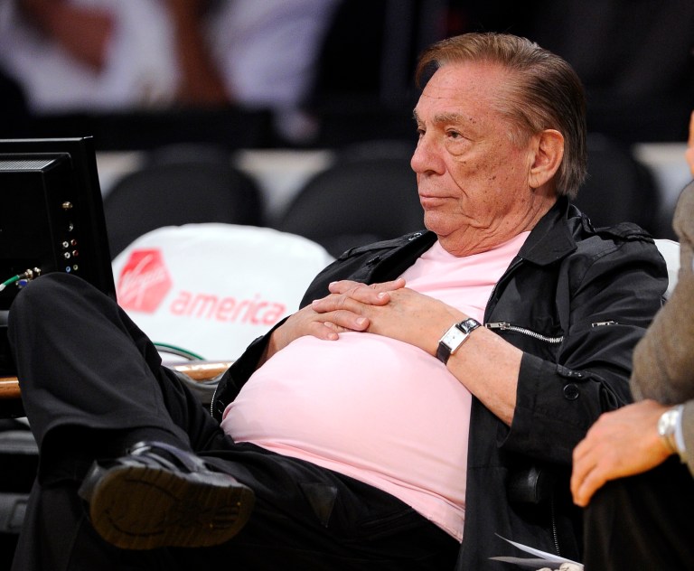 FILE - In this Oct. 16, 2010, file photo, Los Angeles Clippers team owner Donald Sterling watches his team play the Utah Jazz during the second half of their preseason NBA basketball game in Los Angeles. Steve Ballmer is officially the new owner of the Clippers. The team says the sale closed Tuesday, Aug. 12, 2014,  after a California court confirmed the authority of Shelly Sterling, on behalf of the Sterling Family Trust, to sell the franchise.(AP Photo/Mark J. Terrill, File)