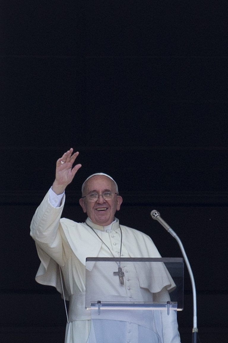 Pope Francis delivers his blessing during the Angelus noon prayer he celebrated from the window of his studio overlooking St. Peter's Square, at the Vatican, Sunday, Aug. 10, 2014. Pope Francis has expressed outrage at violence aimed at religious minorities in Iraq that has seen children die of thirst, and said his emissary would depart Rome on Monday. In a strongly worded message during his traditional Sunday blessing, Francis said the news from Iraq 
