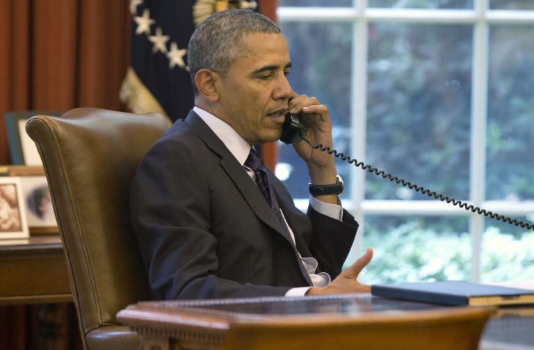 President Obama speaks on the phone in the Oval Office of the White House on Monday during a conference call hosted by the American Lung Association to discuss new commonsense steps to reduce carbon pollution from power plants. (AP/Jacquelyn Martin)