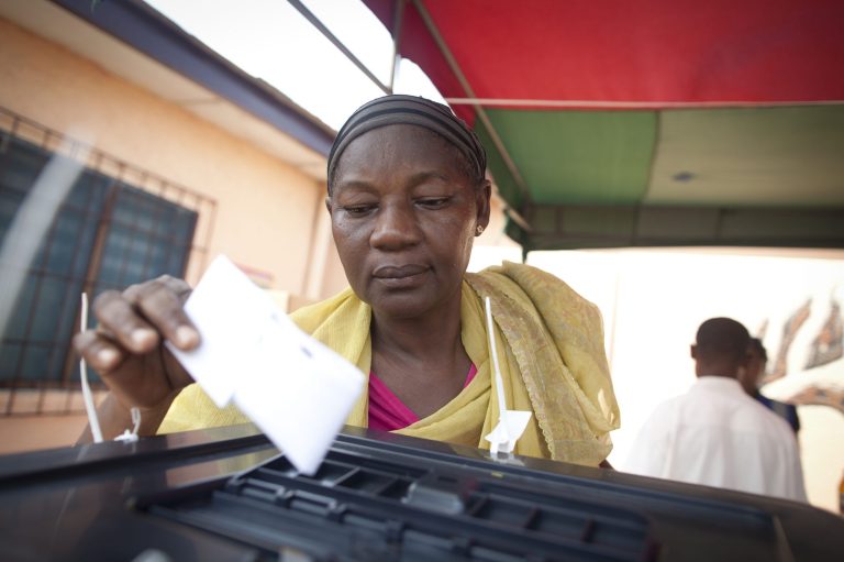   A woman casts her vote for president, during an unexpected second day of voting in Accra, Ghana, Saturday, Dec. 8, 2012. About 225 polling stations reopened Saturday for an impromptu second day of voting after there were technical breakdowns on the first day of voting, Ghana voting officials announced. Some voters waited in line all day Friday and then returned to vote on Saturday. (AP Photo/Gabriela Barnuevo)  