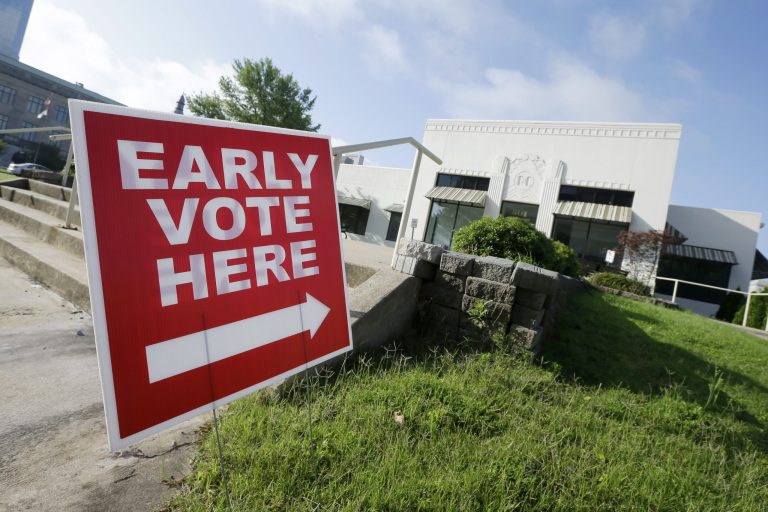A sign points to an early voting site in Little Rock, Ark., for the primary runoff election in June. (AP/Danny Johnston)