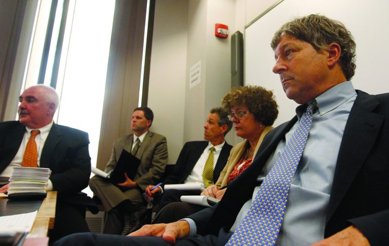 David Meier, right, special consul to the Governor appointed to lead the review of drug convictions which might have been compromised by a State Police drug testing lab, leads a meeting at the Department of Public Safety in Boston, Monday, Sept. 24, 2012. Prosecutors, defense attorney's along with representatives from the District Attorney's office, the U.S. Attorney's office, the State Police and the Department of Public Safety were in attendance. (AP Photo/Stephan Savoia)