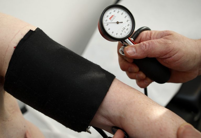   FILE - In this Feb. 6, 2009 file photo, a general practitioner measures the blood pressure of a man at a surgery in Stuttgart, Germany. Nearly everywhere around the world, people are living longer and fewer children are dying. But more and more the world is grappling with the diseases and disabilities of modern life, according to the most expansive global look so far at life expectancy and the biggest health threats nation by nation. (AP Photo/Thomas Kienzle, File)  