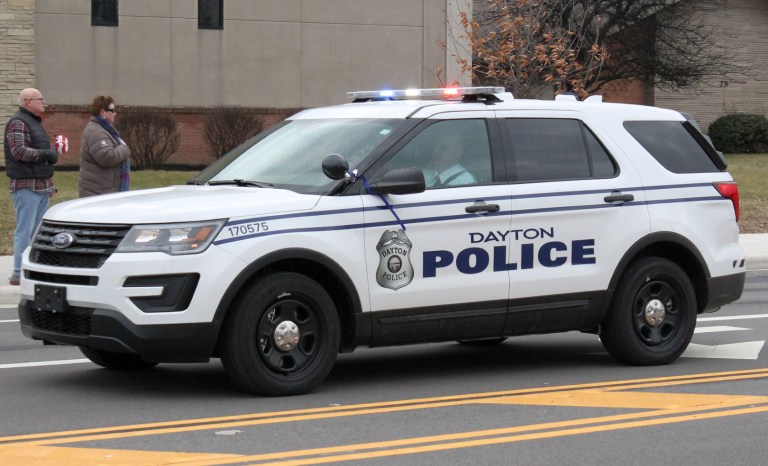 Two children killed and at least 10 injured by stabbing suspect in a stolen cop car