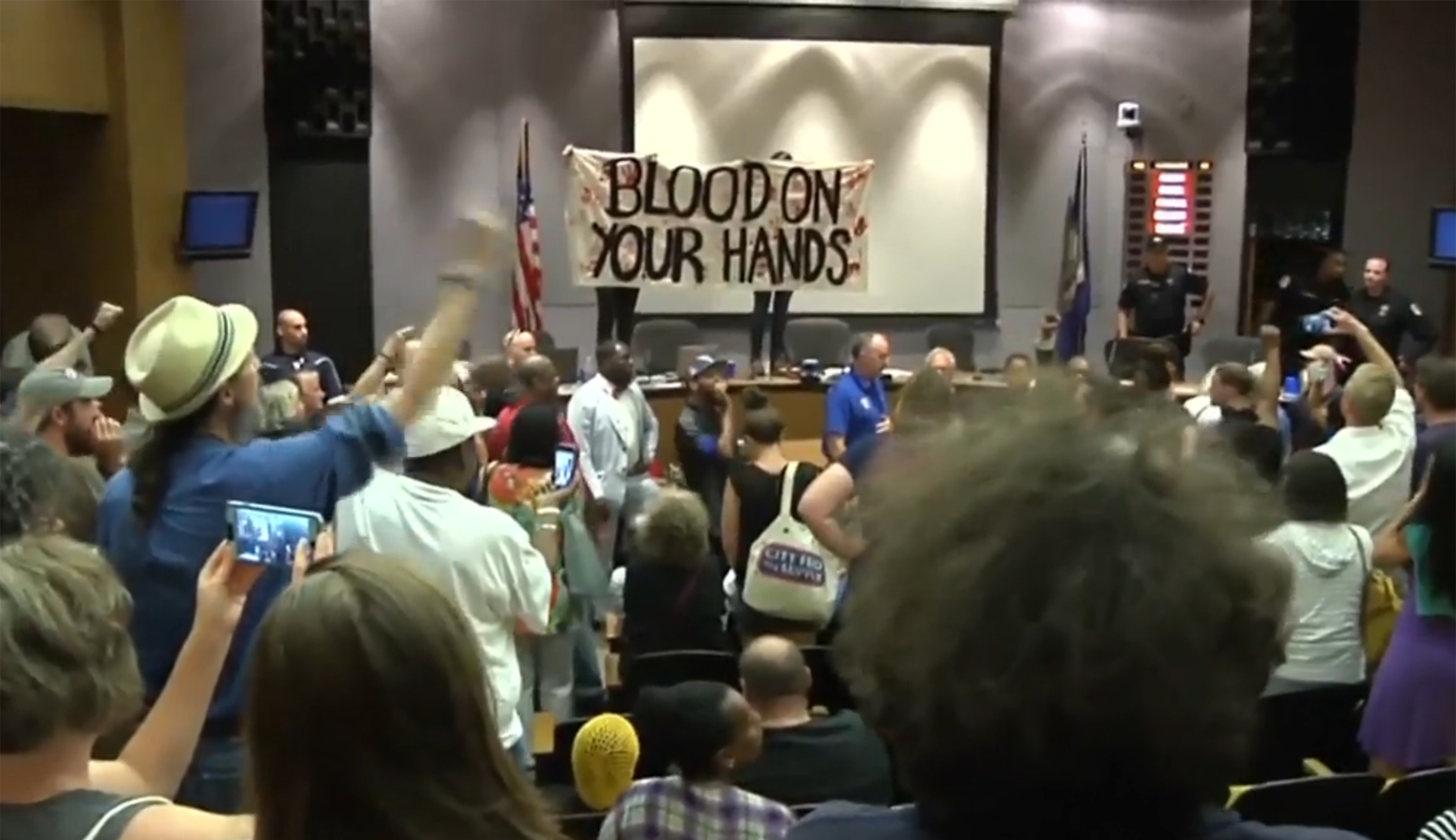 Watch: Protesters disrupt Charlottesville city council meeting with ‘blood on your hands’ banner