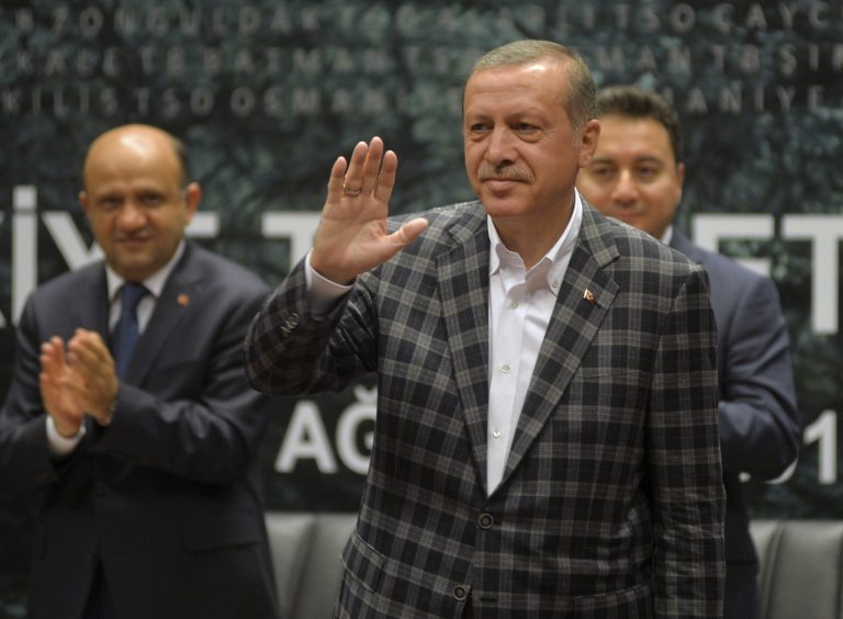 In this Thursday, Aug. 7, 2014 photo, Turkish Prime Minister and presidential candidate Recep Tayyip Erdogan salutes as addresses a business meeting in Ankara, Turkey. Turkey holds its first direct presidential elections on Sunday, Aug. 10, 2014, when voters will be tasked with choosing between three candidates for the post, which until now has been largely ceremonial. The 60-year-old Erdogan, who has dominated Turkish politics for the past decade, is widely expected to win, possibly even in the first round. A gifted public orator who grew up in a tough neighborhood of Istanbul, Erdogan leads the Islamic-rooted Justice and Development Party, or AKP, whose support base is the Turkish heartland. (AP Photo)