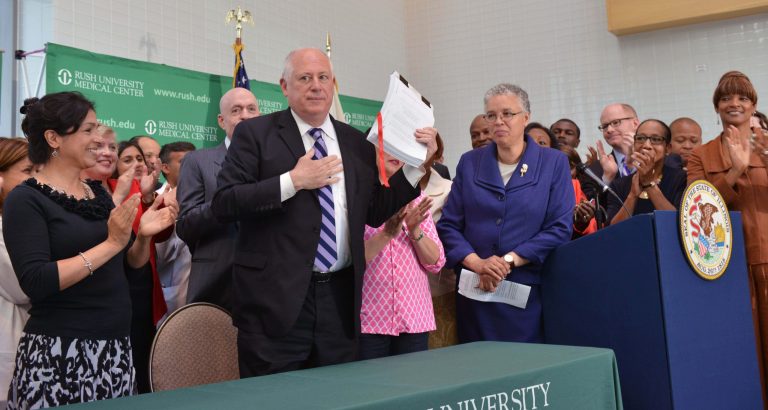 Illinois Gov. Pat Quinn stands after signing legislation to restore Medicaid cuts made two years ago along with other changes that will modernize the program during a news conference at Rush University Medical Center Monday, June 16, 2014 in Chicago. (AP Photo/Sun-Times Media, Al Podgorski )  MANDATORY CREDIT, MAGS OUT, NO SALES