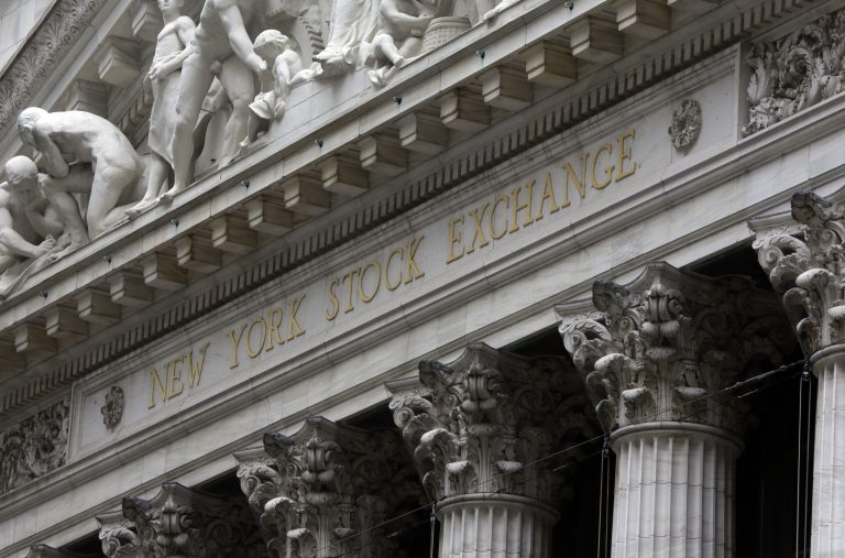 This Oct. 2, 2014 photo shows the facade of the New York Stock Exchange, in New York. U.S. stock indexes are following other global markets lower in early trading Tuesday, Oct. 7, 2014. (AP Photo/Richard Drew)