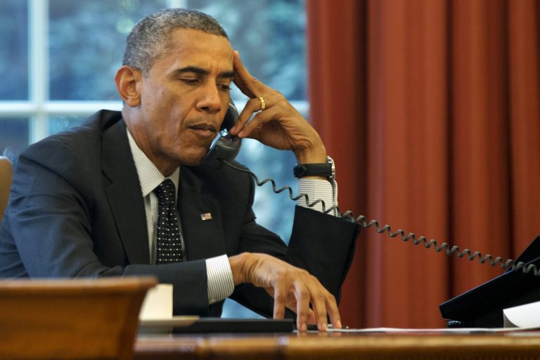 President Barack Obama listens during a phone call with Jordan's King Abdullah II Jordan, according to the White House, Friday, Aug. 8, 2014, in the Oval Office of the White House in Washington. (AP Photo/Jacquelyn Martin)