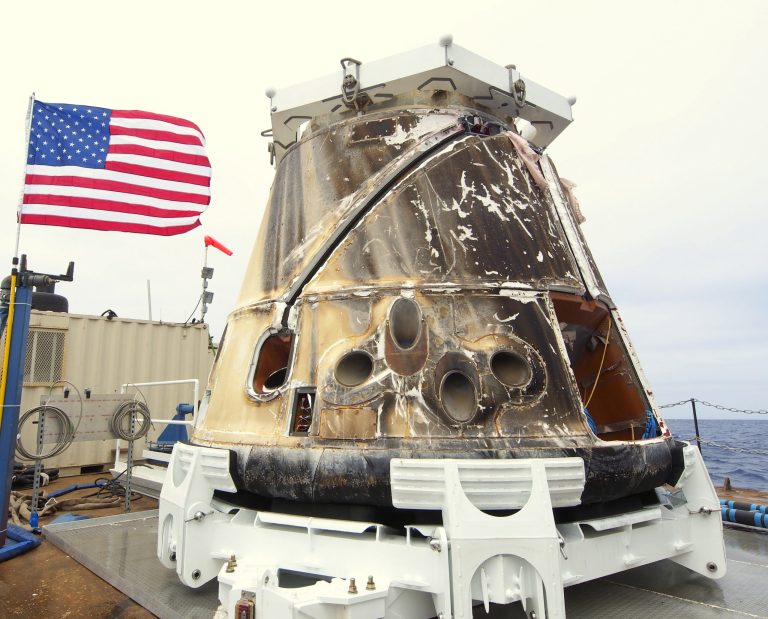   FILE - This Thursday, May 31, 2012 photo provided by SpaceX shows the Dragon spacecraft on a ship in the Pacific Ocean. The capsule arrived by barge at the Port of Los Angeles on Tuesday, June 5, 2012. The unmanned supply ship splashed into the Pacific, west of Baja California, Thursday following an unprecedented trip to the International Space Station. (AP Photo/SpaceX)  