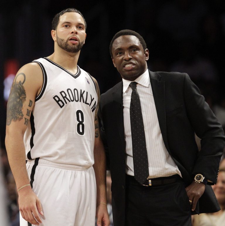   FILE - In this Dec. 11, 2012, file photo, Brooklyn Nets guard Deron Williams (8) and head coach Avery Johnson chat during the second half of an NBA basketball game against the New York Knicks at the Barclays Center in New York. Johnson was fired on Thursday, Dec. 27, 2012, general manager Billy King announced. (AP Photo/Kathy Willens, File)  