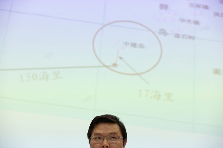 In this May 8, 2014 photo, Yi Xianliang, deputy director-general of Chinese Ministry of Foreign Affairs' Department of Boundary and Ocean Affairs, attends a press conference in front of a map showing a disputed zone in South China Sea in Beijing. Chinaâs planting of an oil platform in contested waters off Vietnam drew strident complaints from Hanoi, a messy standoff between ships and violent protests among Vietnamese, but nothing to dislodge the rig and no broader pushback in the region. (AP Photo/Alexander F. Yuan)