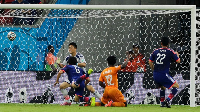 Ivory Coast's Wilfried Bony, (12), scores his side's first goal during the group C World Cup soccer match between Ivory Coast and Japan at the Arena Pernambuco in Recife, Brazil, Saturday, June 14, 2014.   (AP Photo/Shuji Kajiyama)