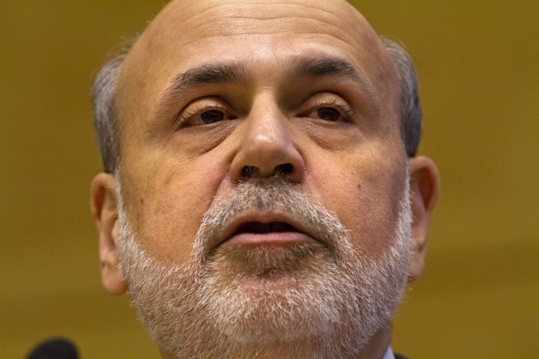 FILE - In this Friday, Nov. 8, 2013, file photo, Federal Reserve Chairman Ben Bernanke speaks on a panel at the International Monetary Fund (IMF) in Washington. Members of the Federal Reserve agreed in October 2013, that they would likely start reducing their bond purchases in coming months if the job market improved further.  (AP Photo/Jacquelyn Martin, File)