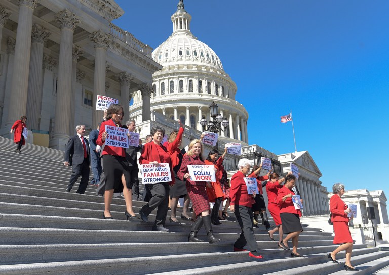 Democratic House members walk down the steps of Capitol Hill in Washington on Wednesday for an event to honor International Women's Day. (AP Photo/Susan Walsh)