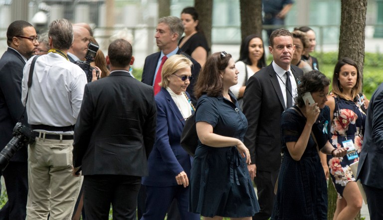 FILE - In this Sept. 11, 2016, file photo Democratic presidential candidate Hillary Clinton, center, attends a ceremony for the 15th anniversary of the attacks of the World Trade Center at the National September 11 Memorial, in New York. (AP Photo/Andrew Harnik)