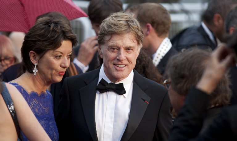 Actor Robert Redford, centre, and his wife Sibylle Szaggars, centre left, arrive for the screening of All Is Lost at the 66th international film festival, in Cannes, southern France, Wednesday, May 22, 2013. (AP Photo/Virginia Mayo)