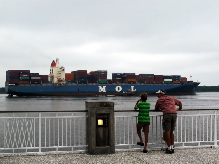   FILE - In this Saturday, Aug. 17, 2013, file photo, a container ship moves through Charleston Harbor to the South Carolina State Ports Authority's Wando Terminal in Mount Pleasant, S.C. The government reports on the U.S. trade deficit for July, on Wednesday, Sept. 4, 2013. (AP Photo/Bruce Smith, File)  